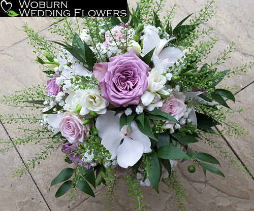 Soft Rose and Orchid hand tied bouquet.