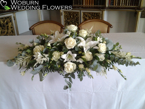 Rose, lilly and freesia registrars table arrangement.