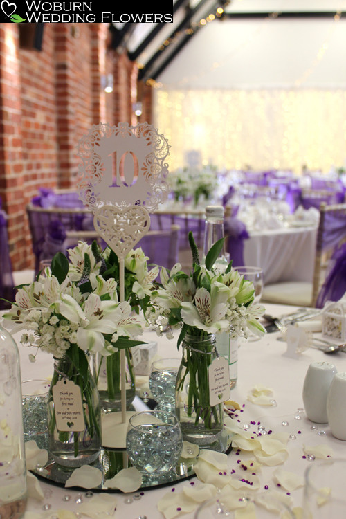 Bud vases of Alstroemeria and Babys Breath.