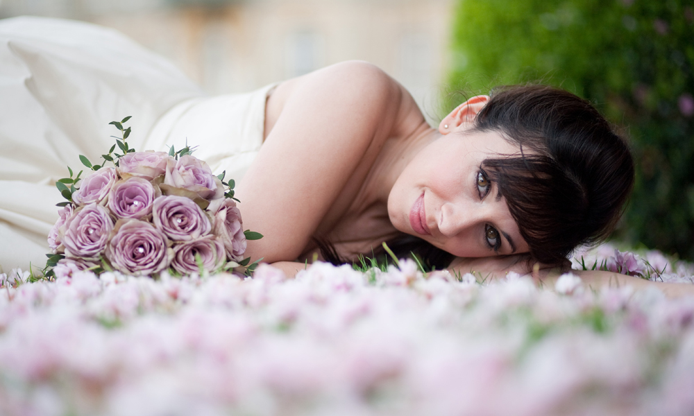 Bride with beautiful hand tied bouquet.