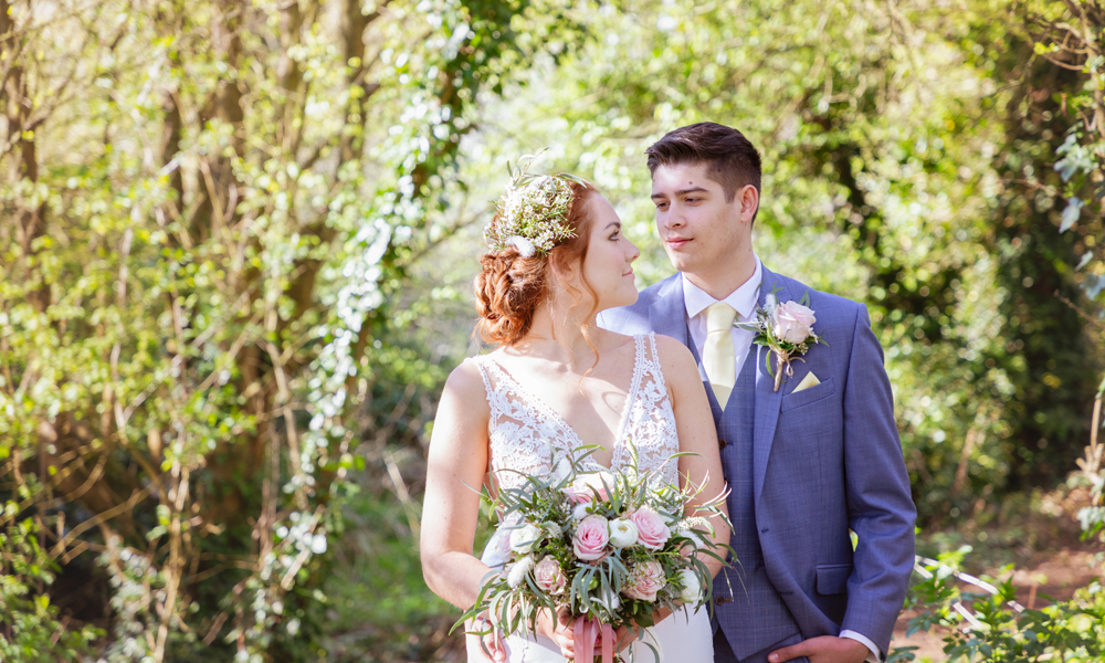 Bride and Groom in a woodland setting.