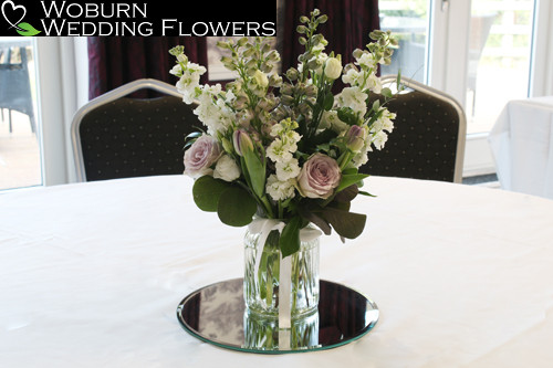 Vase of Ayden Roses, delphinium, stocks and tulips.